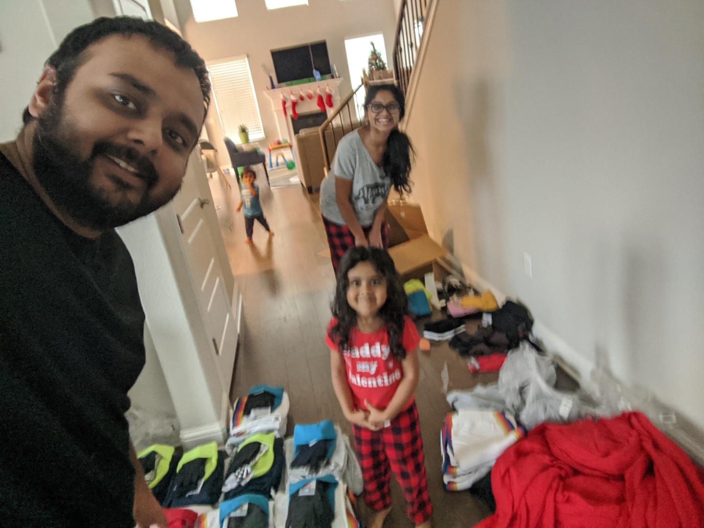 Purav, Purvi, and Arya packing care bundles for the homeless